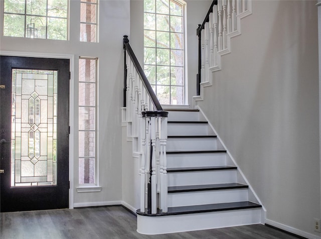 3222 Serene Oak Dr, Sugar Land, TX 77478 - foyer entrance with wood finished floors, stairs, and baseboards