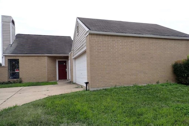 12403 Seaswept Dr, Houston, TX 77071 - view of front facade featuring concrete driveway, brick siding, a garage, and a front lawn