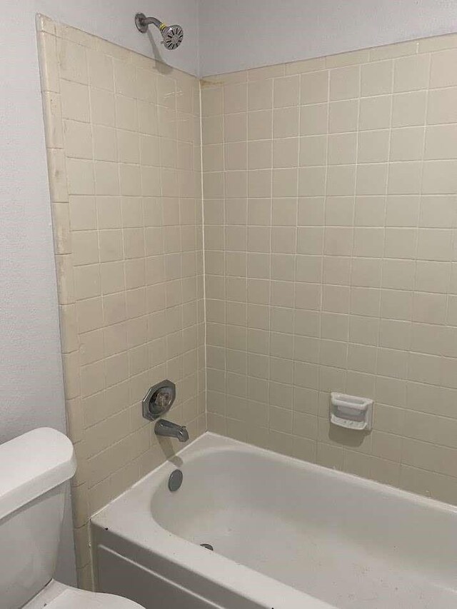 12403 Seaswept Dr, Houston, TX 77071 - bathroom featuring bathing tub / shower combination and toilet
