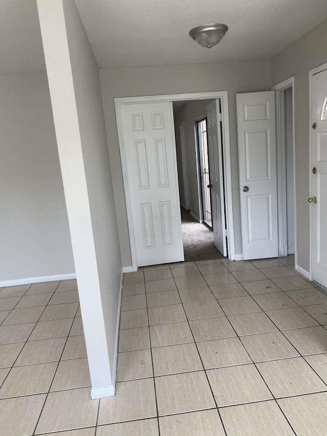 12403 Seaswept Dr, Houston, TX 77071 - interior space featuring light tile patterned flooring and baseboards
