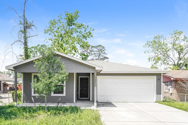 single story home with a garage and driveway