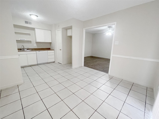 12023 Greenwood Forest Dr Unit B, Houston, TX 77066 - kitchen with white cabinetry, open shelves, visible vents, dishwasher, and a sink