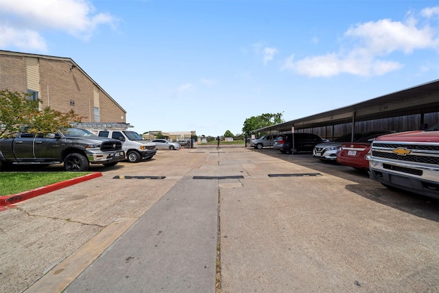 view of partially covered parking lot