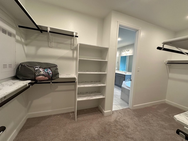spacious closet featuring carpet and visible vents