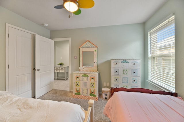 carpeted bedroom featuring ceiling fan