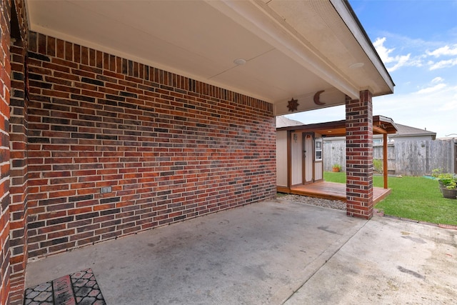 view of patio featuring fence