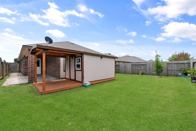 back of property with a yard and a fenced backyard