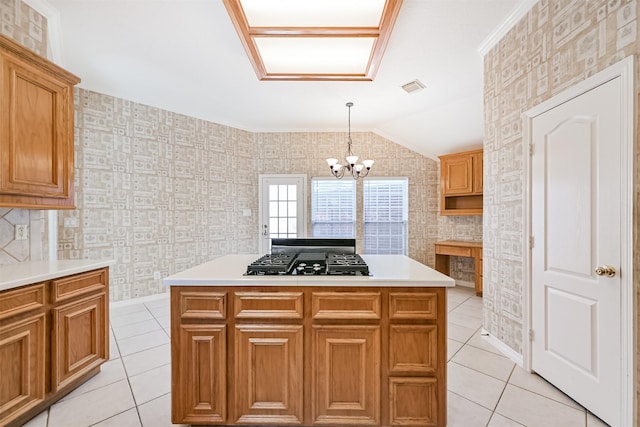 kitchen with light tile patterned flooring, black gas cooktop, visible vents, and a notable chandelier