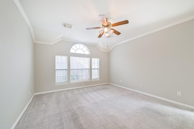 empty room featuring ornamental molding, baseboards, a ceiling fan, and visible vents