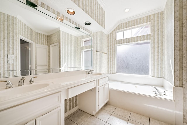 full bathroom with wallpapered walls, tile patterned flooring, double vanity, a sink, and a garden tub