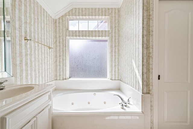 bathroom with wallpapered walls, a jetted tub, vanity, and ornamental molding