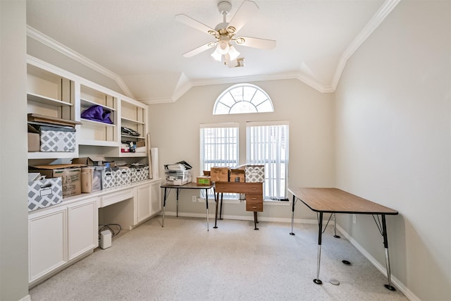 office area featuring lofted ceiling, a ceiling fan, baseboards, and ornamental molding