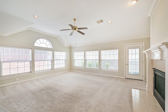 unfurnished living room featuring a fireplace with flush hearth, baseboards, visible vents, lofted ceiling, and a ceiling fan