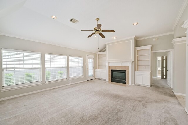 unfurnished living room with visible vents, a ceiling fan, baseboards, a fireplace, and light colored carpet