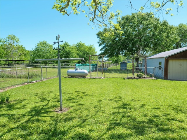 view of yard featuring a fenced backyard and an outdoor structure