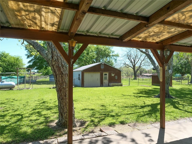 view of yard with an outdoor structure and fence