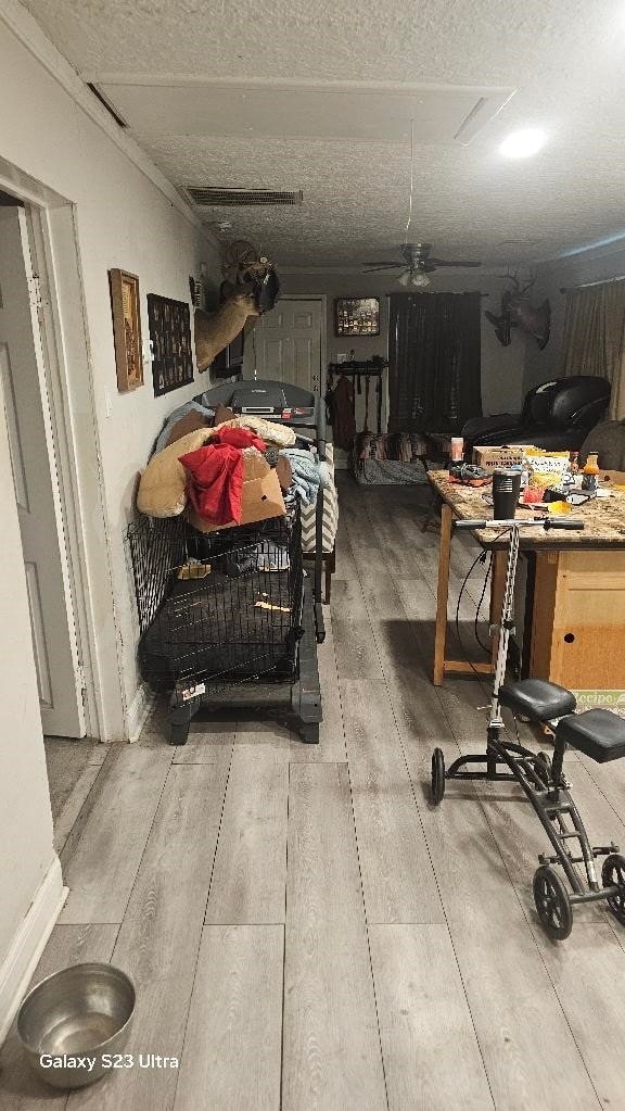 garage with visible vents and a ceiling fan