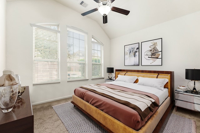 bedroom with baseboards, carpet flooring, a ceiling fan, visible vents, and lofted ceiling