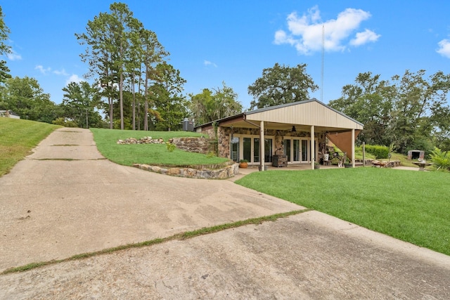 exterior space featuring a patio and a lawn