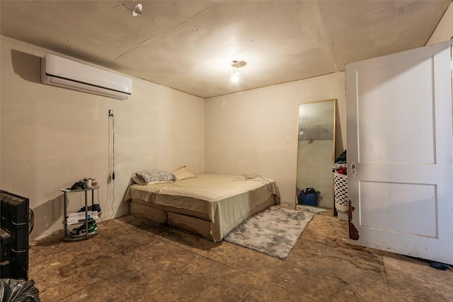 bedroom with concrete floors and a wall mounted air conditioner
