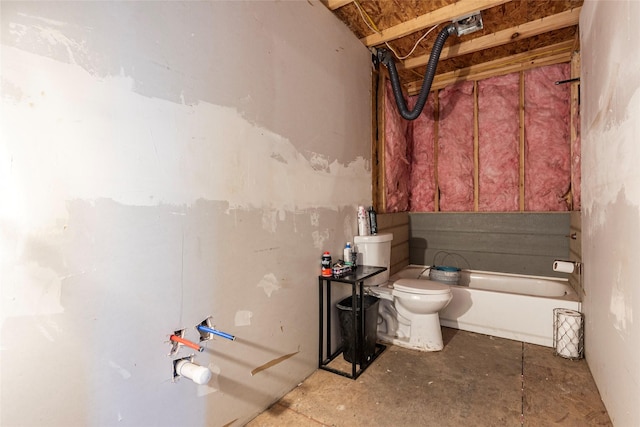 bathroom with a bath, unfinished concrete flooring, and toilet