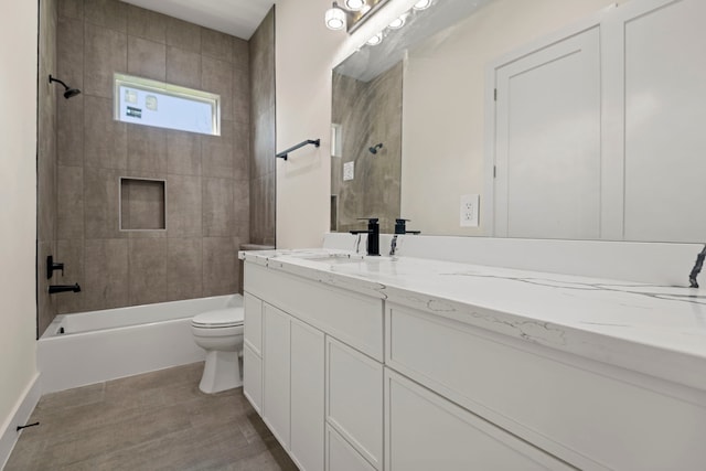 bathroom with toilet, washtub / shower combination, and vanity