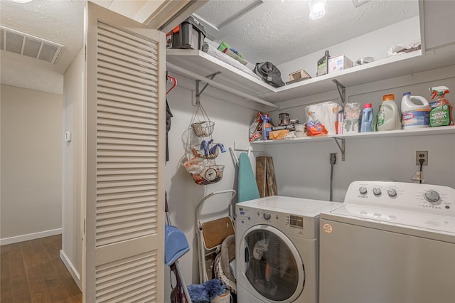 301 Chestnut Bnd, Huntsville, TX 77320 - laundry area with laundry area, wood finished floors, visible vents, independent washer and dryer, and a textured ceiling