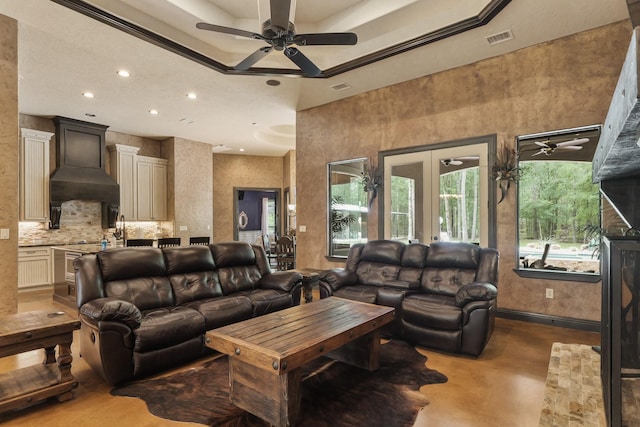living area with recessed lighting, a ceiling fan, visible vents, and finished concrete flooring