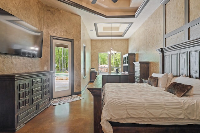 bedroom featuring access to exterior, finished concrete flooring, a chandelier, and a tray ceiling