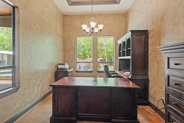 office area with baseboards, an inviting chandelier, and a textured wall