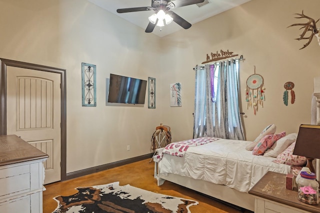 bedroom featuring concrete flooring and ceiling fan