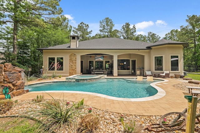 view of pool featuring a patio, an outdoor hangout area, a ceiling fan, and a pool with connected hot tub