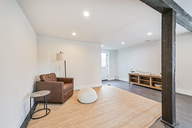 living area featuring recessed lighting, baseboards, and wood finished floors