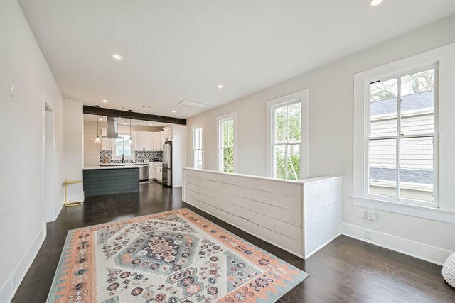 hall with recessed lighting, baseboards, and dark wood-style floors