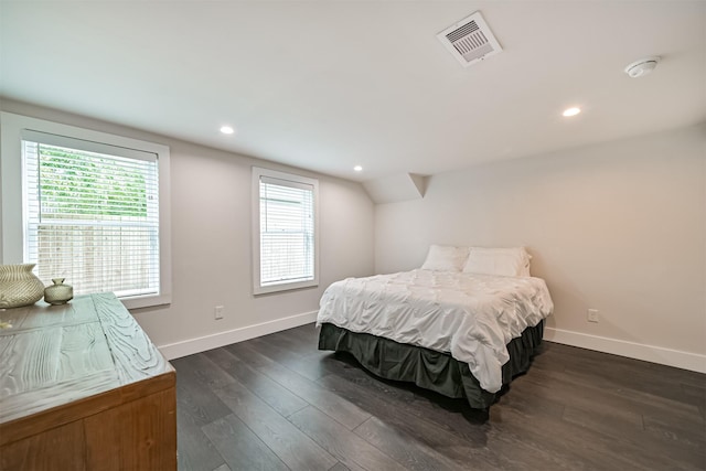 bedroom with visible vents, dark wood-style flooring, baseboards, and recessed lighting