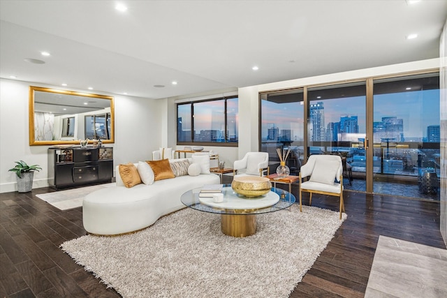 living area featuring baseboards, recessed lighting, a view of city, and wood finished floors
