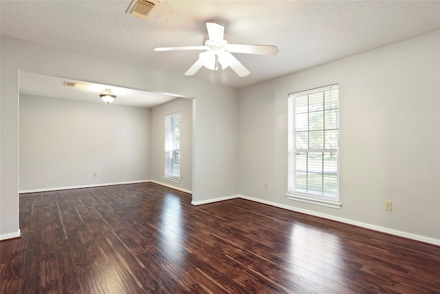 10507 Twin Oak Dr, Conroe, TX 77385 - empty room featuring wood finished floors, baseboards, and a ceiling fan