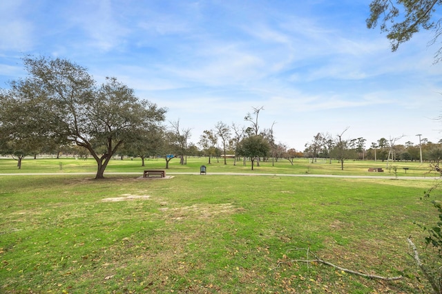 view of property's community with a lawn