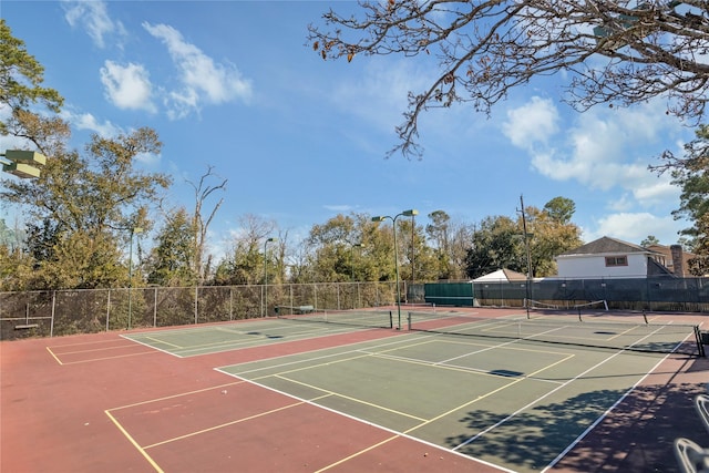 view of sport court featuring community basketball court and fence