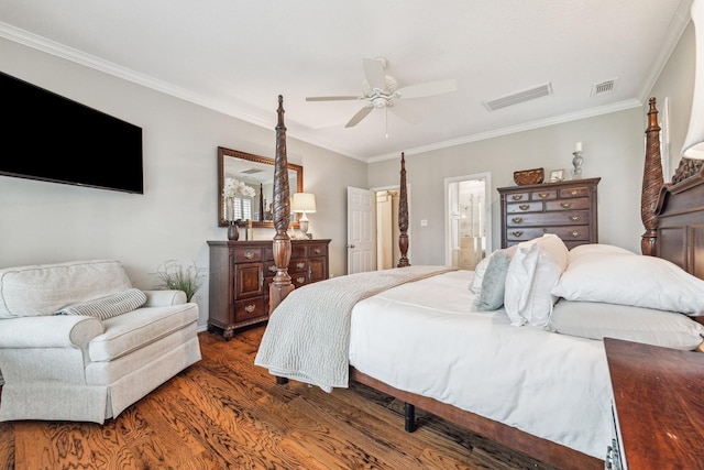 bedroom featuring crown molding, wood finished floors, ceiling fan, and visible vents