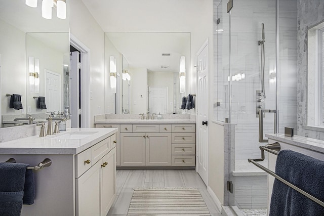 17939 Channel Hill Dr, Cypress, TX 77433 - full bathroom featuring a stall shower, two vanities, and a sink