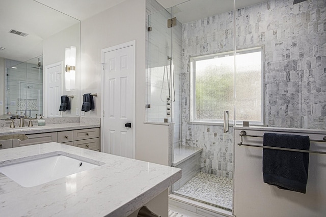 17939 Channel Hill Dr, Cypress, TX 77433 - bathroom featuring a stall shower, vanity, and visible vents