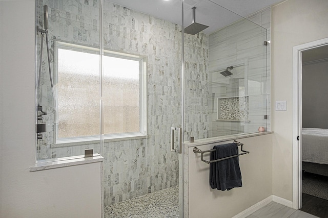 17939 Channel Hill Dr, Cypress, TX 77433 - ensuite bathroom featuring ensuite bath, baseboards, and a tile shower