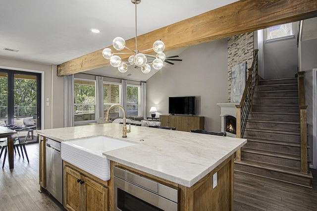 17939 Channel Hill Dr, Cypress, TX 77433 - kitchen with a sink, hanging light fixtures, open floor plan, and stainless steel appliances