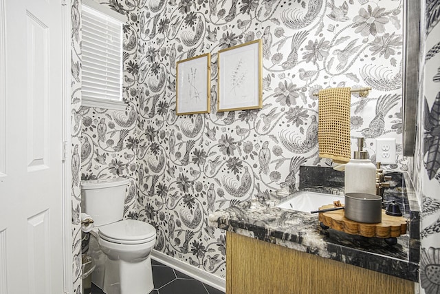 17939 Channel Hill Dr, Cypress, TX 77433 - half bath with vanity, baseboards, wallpapered walls, tile patterned floors, and toilet