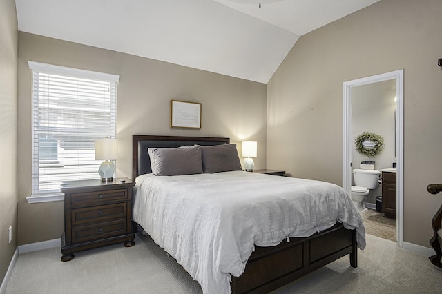 17939 Channel Hill Dr, Cypress, TX 77433 - bedroom with light colored carpet, baseboards, ensuite bathroom, and lofted ceiling