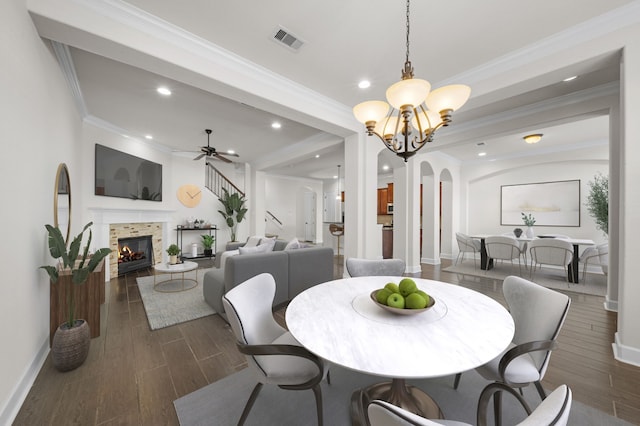 dining space with visible vents, baseboards, recessed lighting, and a tile fireplace