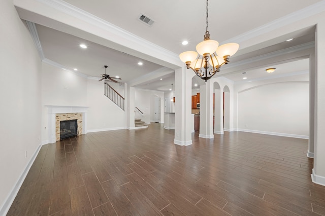 unfurnished living room with visible vents, baseboards, dark wood finished floors, recessed lighting, and a tile fireplace