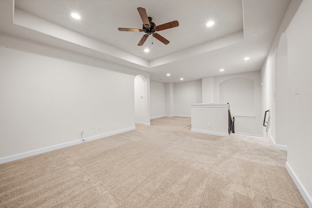 basement with light carpet, recessed lighting, and baseboards