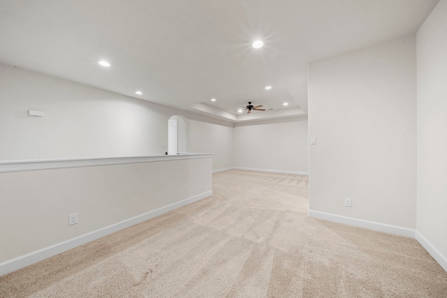 basement with ceiling fan, recessed lighting, light carpet, and baseboards